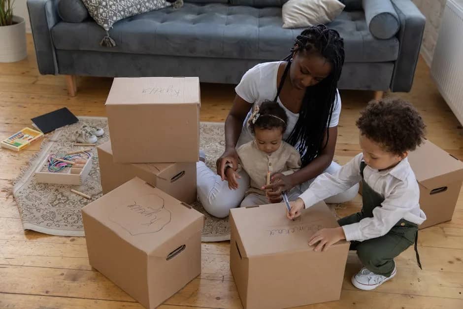 Mother and children packing boxes together in cozy living room environment.